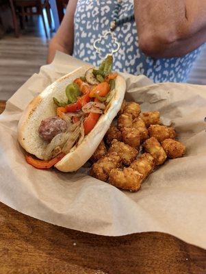 Peppers and sausage with tater tots, marinara sauce on the side