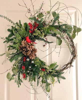 Wreath 2.0 I made with the same base materials and training from the class, updated with some winter greenery.