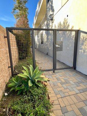 apartment complex security gate with fence