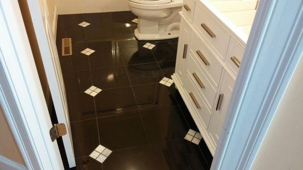 Granite tile with marble inlays