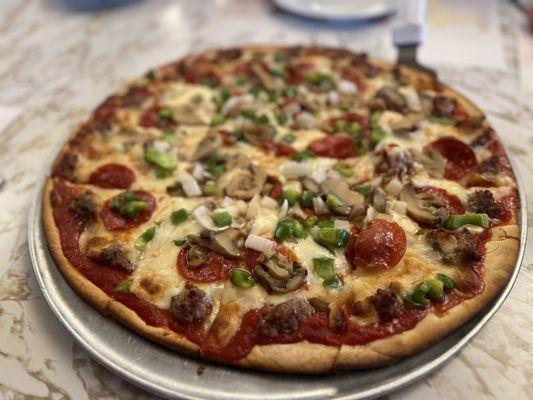 Pepperoni, sausage, onions, green peppers, and mushrooms