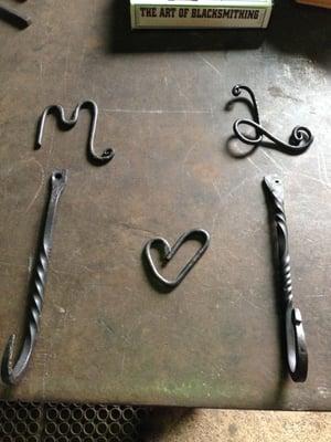 Wall hooks made at our first attempt at blacksmithing! We decided to use the hooks as leash hooks for our dogs Mishka and Lyra