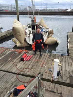 Sailboat salvage in Bridgeport, CT using salvage bags and diving dry suit. Water temperature was 44 degrees