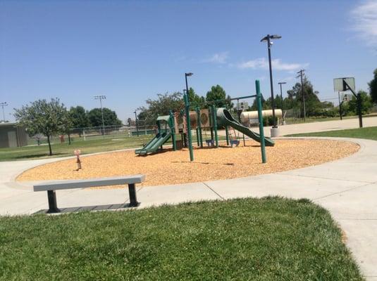 Playground with surrounding benches.