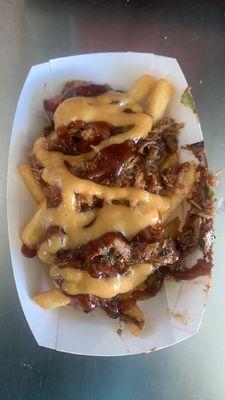 loaded dirty fries with pulled pork and sauce