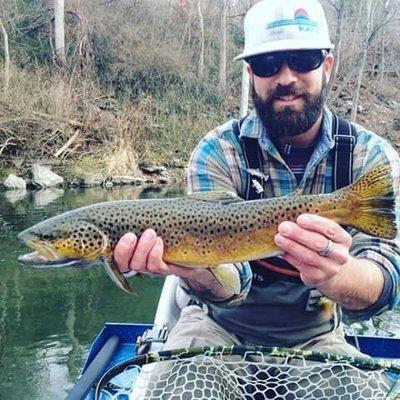 Our local Chris showing of a beautiful  brown trout, we stock a full line of Fly equipment