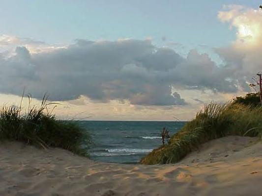 Sand dunes and Lake Michigan at dusk in the Duneland region.