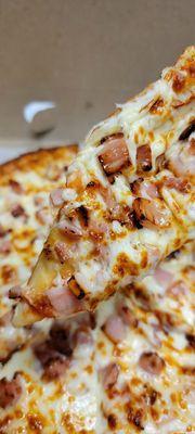 Small pizza with ham.