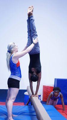 Coach Lia teaching beam during handstand week:)