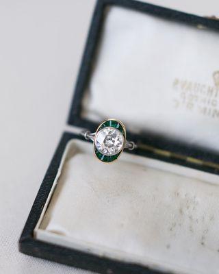 The Sienna ring is a gorgeous Art Deco vintage engagement ring that centers an old European cut diamond with green emerald accents!