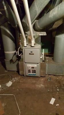 A brand new Ducane 95% efficient furnace replaces a gravity furnace.