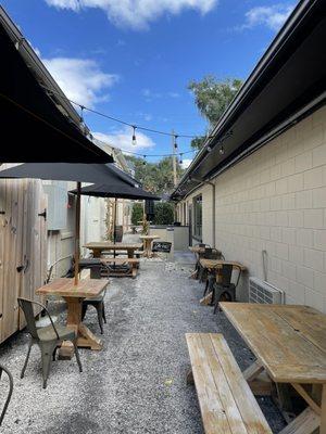 Outdoor seating between some of the shops