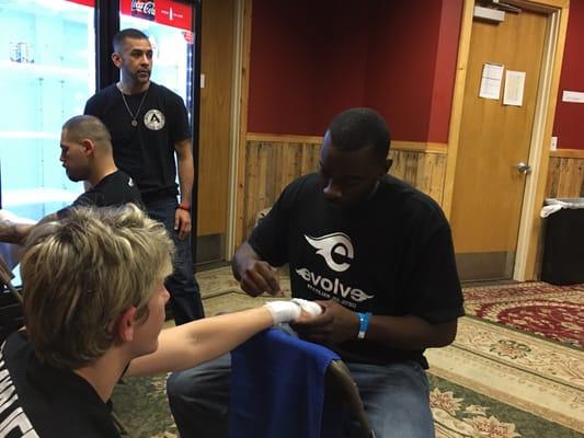 UFC coach Steven Wright wrapping my wife's hands.