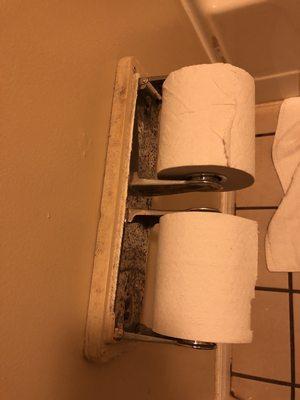 Dirty dusty rusted toilet paper holders