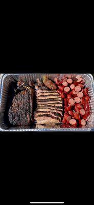 Full prime brisket tray with smoked sausage.