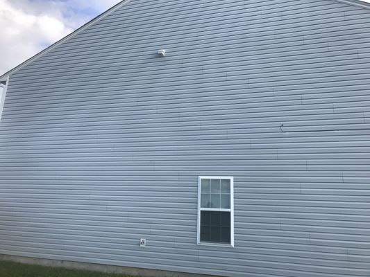 Vinyl siding of a home after cleaning.