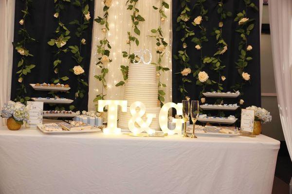 Cake table. They supplied table and linen. We supplied cake, treats, decor and backdrop.