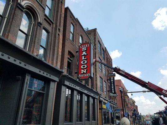 Installing New Sign on Broadway in Nashville, TN