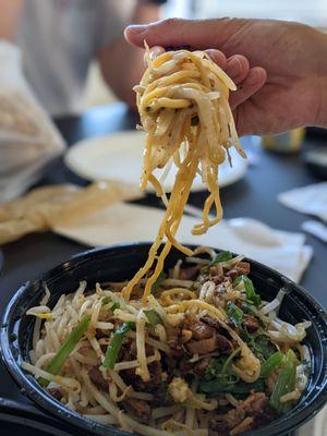 Pork stew over egg noodle