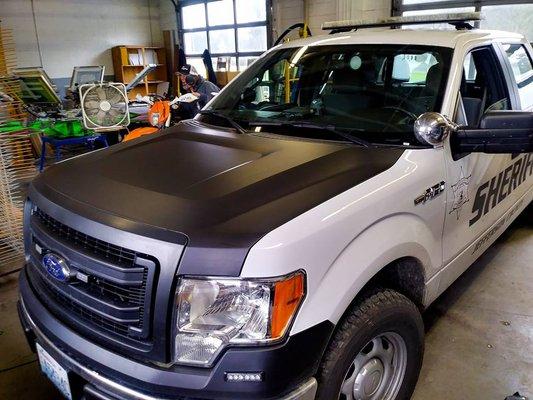 Wrapped this sheriff trucks hood in some flat black vinyl!