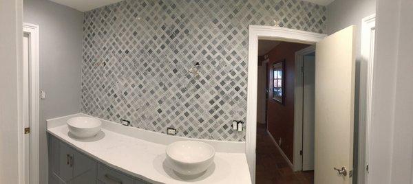 Add character with a mosaic backsplash.