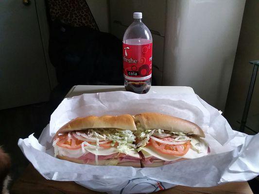 My Italian sub is every bit as big as the 2 liter bottle behind out.  So delicious !