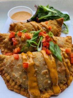 Marty gras Empanadas- 3 Empanadas stuffed w/ Chicken Jambalaya, Crawfish, smoked Gouda and Provolone Cheese