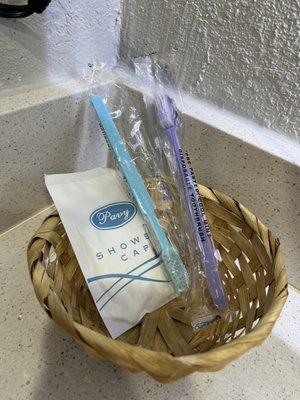 Complimentary toothbrushes and shower cap