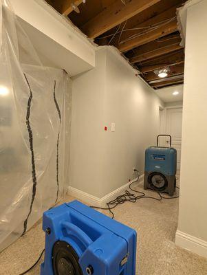 Water damage restoration. Dehumidifier and HEPA air filtration in action