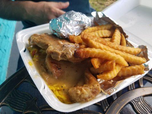 Smothered Pork Chops with rice, two sides, and corn bread; shared with my friend it was very good!  But the smothered chicken was better.