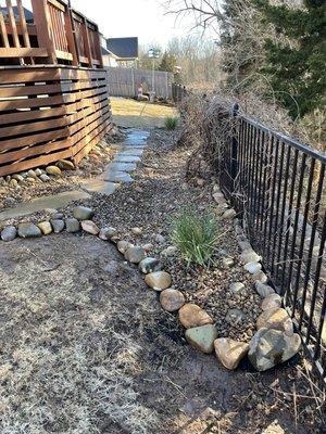 Flagstone pathway, natural boulder border.