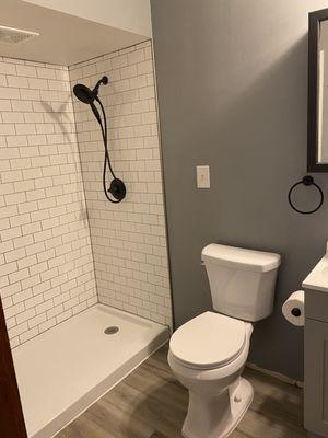 Full bath renovation. Tile install, new toilet, flooring install, and new fixtures installed.