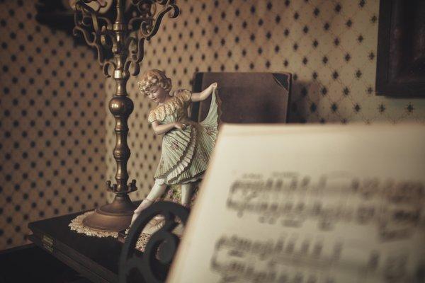 Doll on piano.