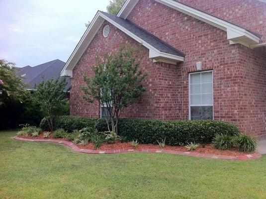 Landscape beds De-weeded, trimmed hedges and add fresh mulch