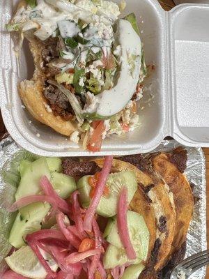 A gordita topped with "Campechana" meat, aka Pastor (pork style) & fajita, lettuce, crema and avocado. Next to it Quesobirria