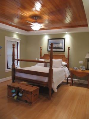 Master Bedroom with Coiffered Ceiling and Hardwood Floors