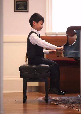 Performing for a spring piano recital.