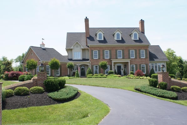 This custom home in Davidsonville, Maryland is a three story, traditional design with an attached garage...