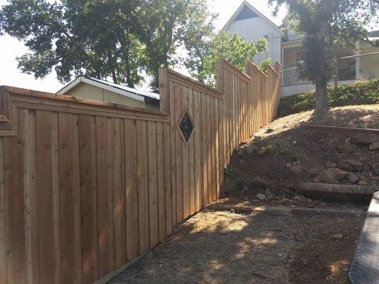 Step stair cedar fence.