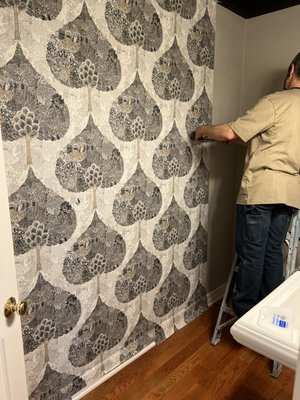 Wallpaper hung in bathroom