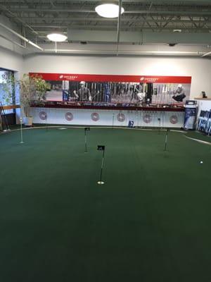 Nice putting green area to try out their great selection of putters!