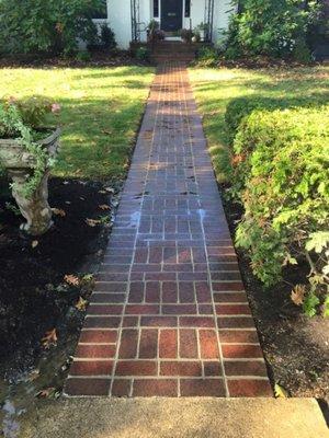 Brick sidewalk restoration and repair.