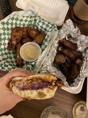 pulled pork sandwich,  lbs of beef brisket, pound of wings