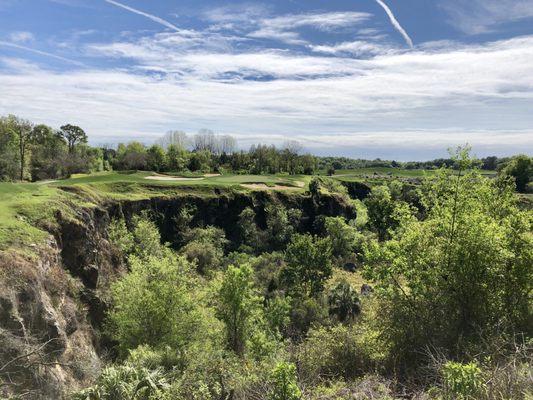 View from 13th tee box to green (par 3 over quarry)