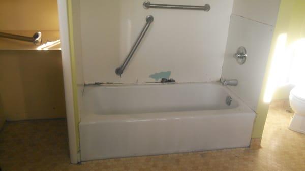 Old rotten shower surround