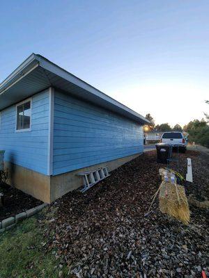 Detached garage, new LVP siding, waterproof paint, new window installation & gutters!