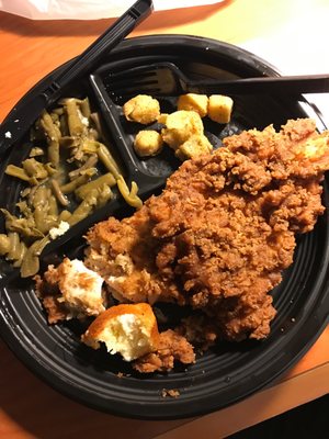 Chicken fried chicken, fried okra, green beans and corn muffin partially eaten.