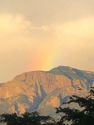 Rainbow or rainbar over mountains