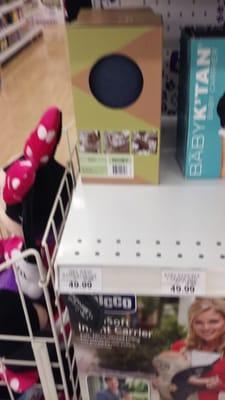 The item they dont sell. The baby carrier on shelf (in box, left hand side).