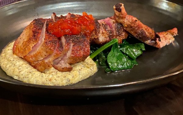 Porcini rubbed heritage pork chop, buckwheat polenta, local spinach and red pepper mostarda